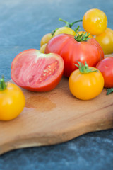 Yellow and red tomatoes on the board