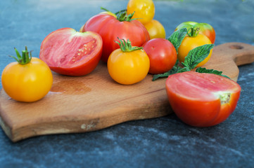 Yellow and red tomatoes on the board