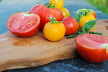 Yellow and red tomatoes on the board