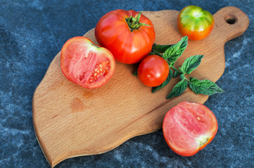 Yellow and red tomatoes on the board