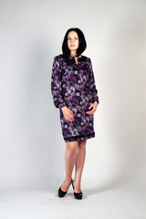 Beautiful young girl  posing on a grey background