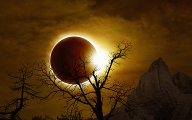 Total solar eclipse in dark glowing sky