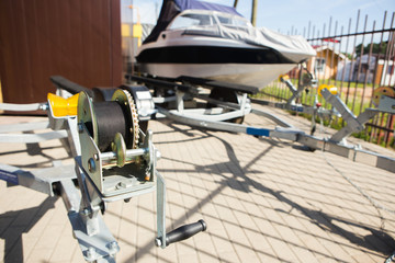 Winch of an automobile trailer for yacht transport