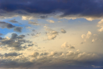 Naklejka na ściany i meble Freedom sky: swirling clouds at dusk. Oneirish sky with clouds after sunset.