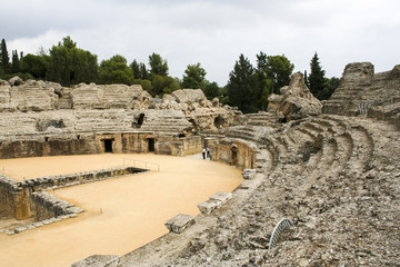 Fototapeta na wymiar The ruins of the Roman amphitheatre at Italica, an ancient city in Andalusia, Spain