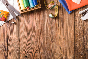 Tailor accessories. Concept. Natural wooden background.