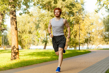 Young adult runner having intensive training