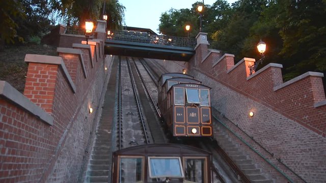 People enjoying the view of Budapest by climbing up to the Gellert Hill with the old funicular lift. Budapest, Hungary.