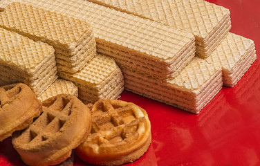 Fresh waffles on a red plate to the day of waffles
