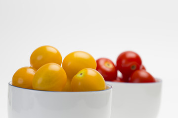 Close up cherry tomatoes in white cup