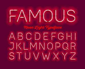 Famous, neon light typeface. Red modern neon tube glow font © piai