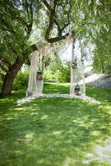 Wedding decor, decor in the trees, flowers in black cages