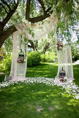 Wedding decor, decor in the trees, flowers in black cages