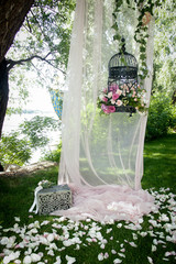 Wedding decor, decor in the trees, flowers in black cages