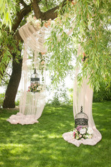 Wedding decor, decor in the trees, flowers in black cages