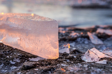 Chunks of ice at sunset on a frosty winter day. Winter landscape
