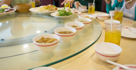 shark fin and fish maw soup in the row on white bowl, Chinese restaurant