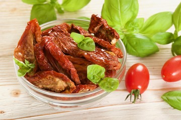 dry tomatoes on a wooden background