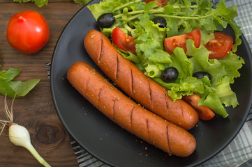 Grilled sausages and vegetables