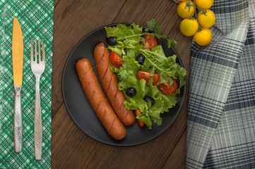 Grilled sausages and vegetables
