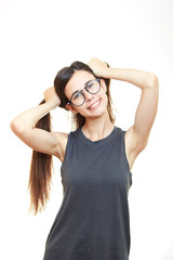 Smiling woman posing isolated on a white background. Hairstyle tails