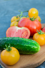 Yellow and red tomatoes on the board