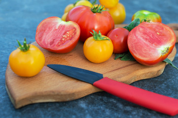 Yellow and red tomatoes on the board