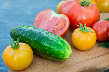 Yellow and red tomatoes on the board