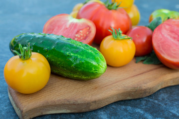 Yellow and red tomatoes on the board