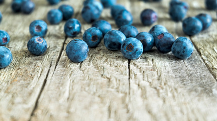 Fresh and sweet blueberries on a wooden background.