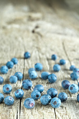 Fresh and sweet blueberries on a wooden background.