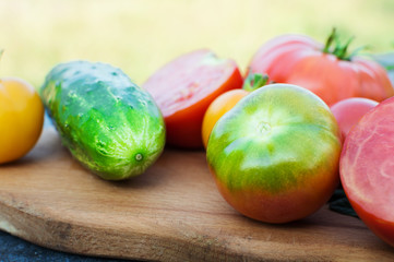 Yellow and red tomatoes on the board