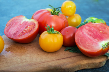 Yellow and red tomatoes on the board