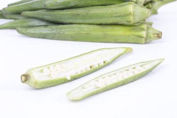 Closeup of okra on a white background.