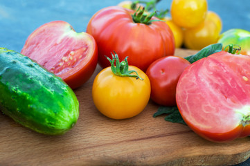 Yellow and red tomatoes on the board