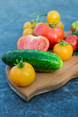 Yellow and red tomatoes on the board