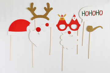 Photo booth colorful props for christmas party - mustache, santa claus, pipe, hat on white background