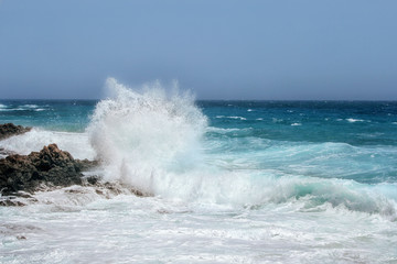 Fuerteventura - corralejo  - Waves of the Ocean crashing against the rocks - full of details photo