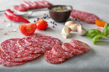 Delicious sliced sausage on table