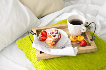 Delicious breakfast on bed