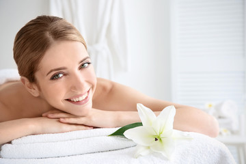 Young beautiful woman relaxing in spa salon