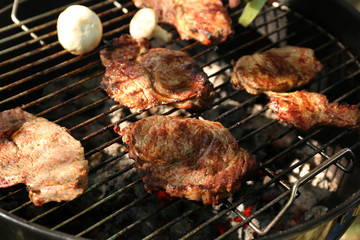 Tasty steaks on barbecue grill