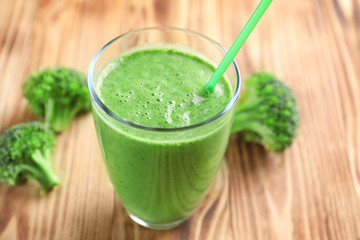Glass of fresh vegetable smoothie on wooden table