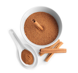 Composition with sweet cinnamon sugar on white background