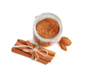 Composition with sweet cinnamon sugar on white background