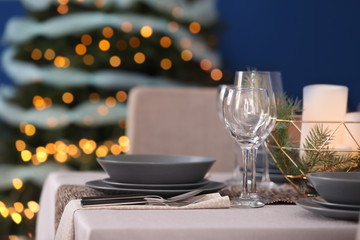 Table served for Christmas dinner in living room