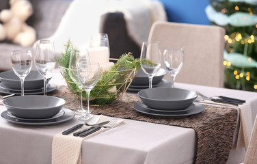 Table served for Christmas dinner in living room