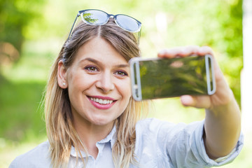 Beautiful woman taking a selife