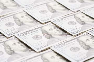 Lot of one hundred dollar bills close-up background