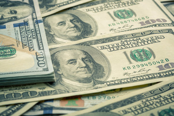 Lot of one hundred dollar bills close-up background